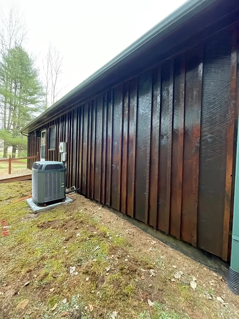 Wood siding after refinishing with a renewed protective finish