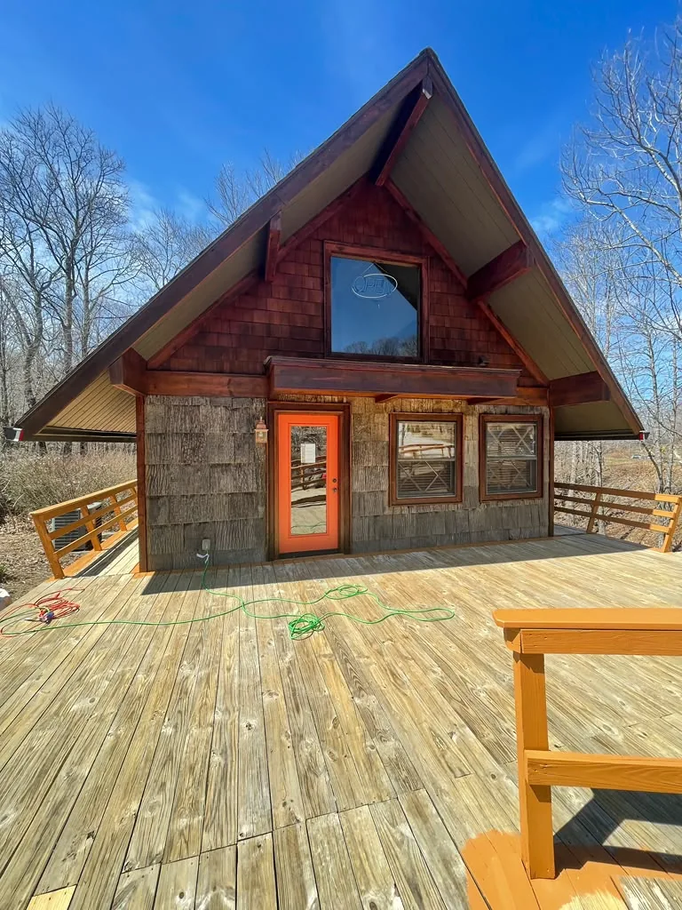 Weathered cabin deck before cleaning and restoration